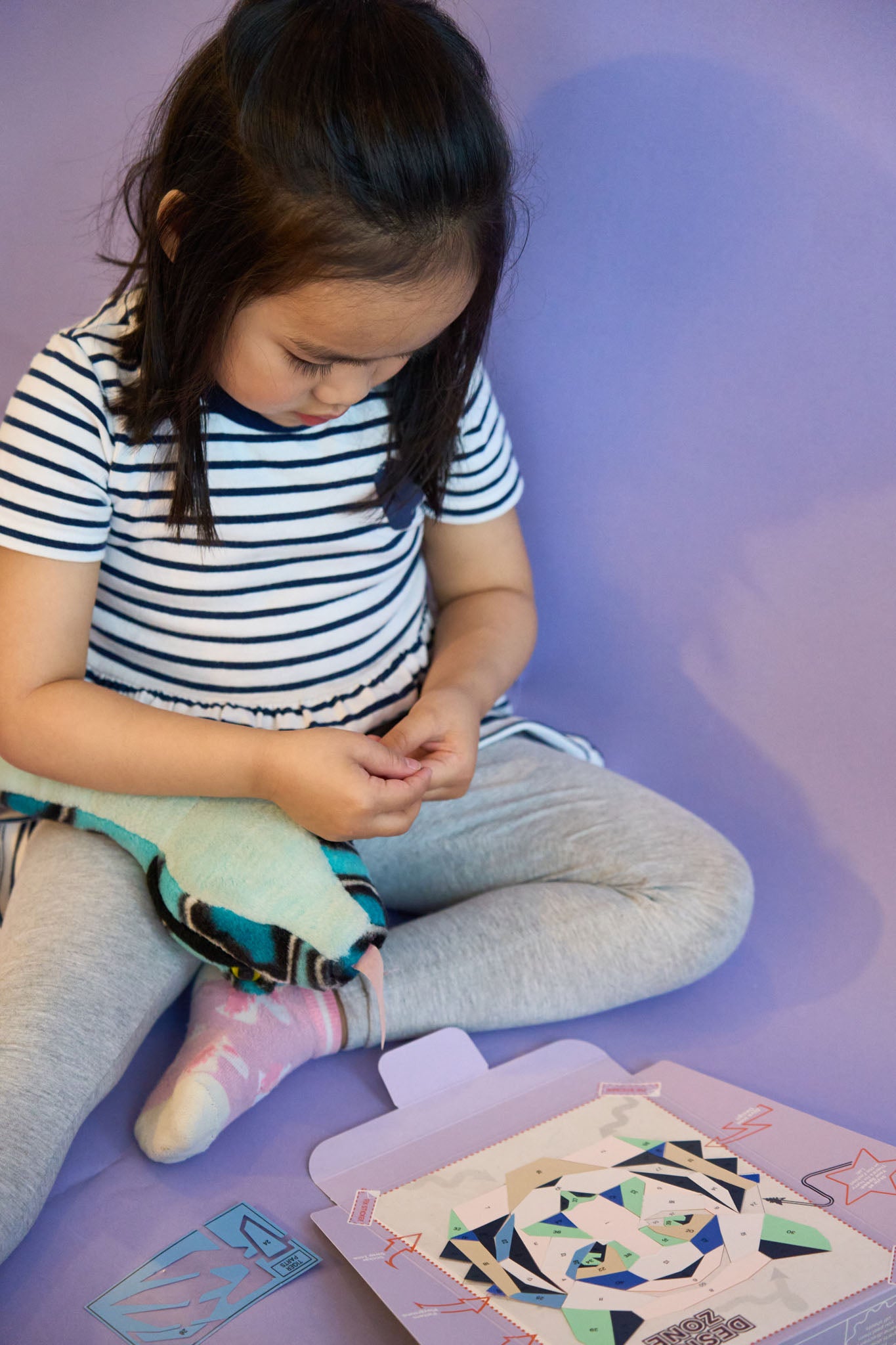 Child practicing creative design with PopKit kit, building skills